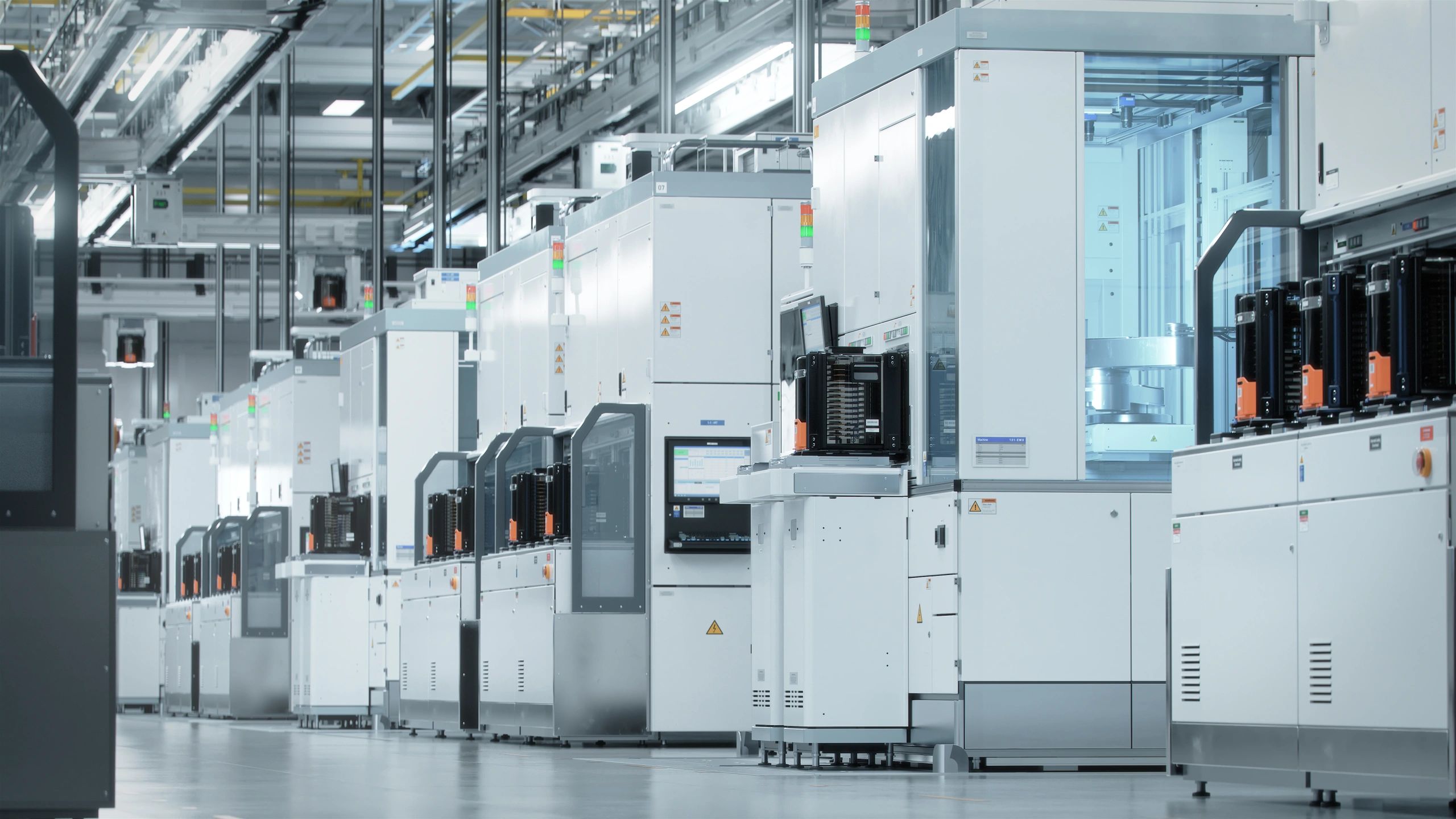 Advanced automated facility with overhead transfer systems and monitoring