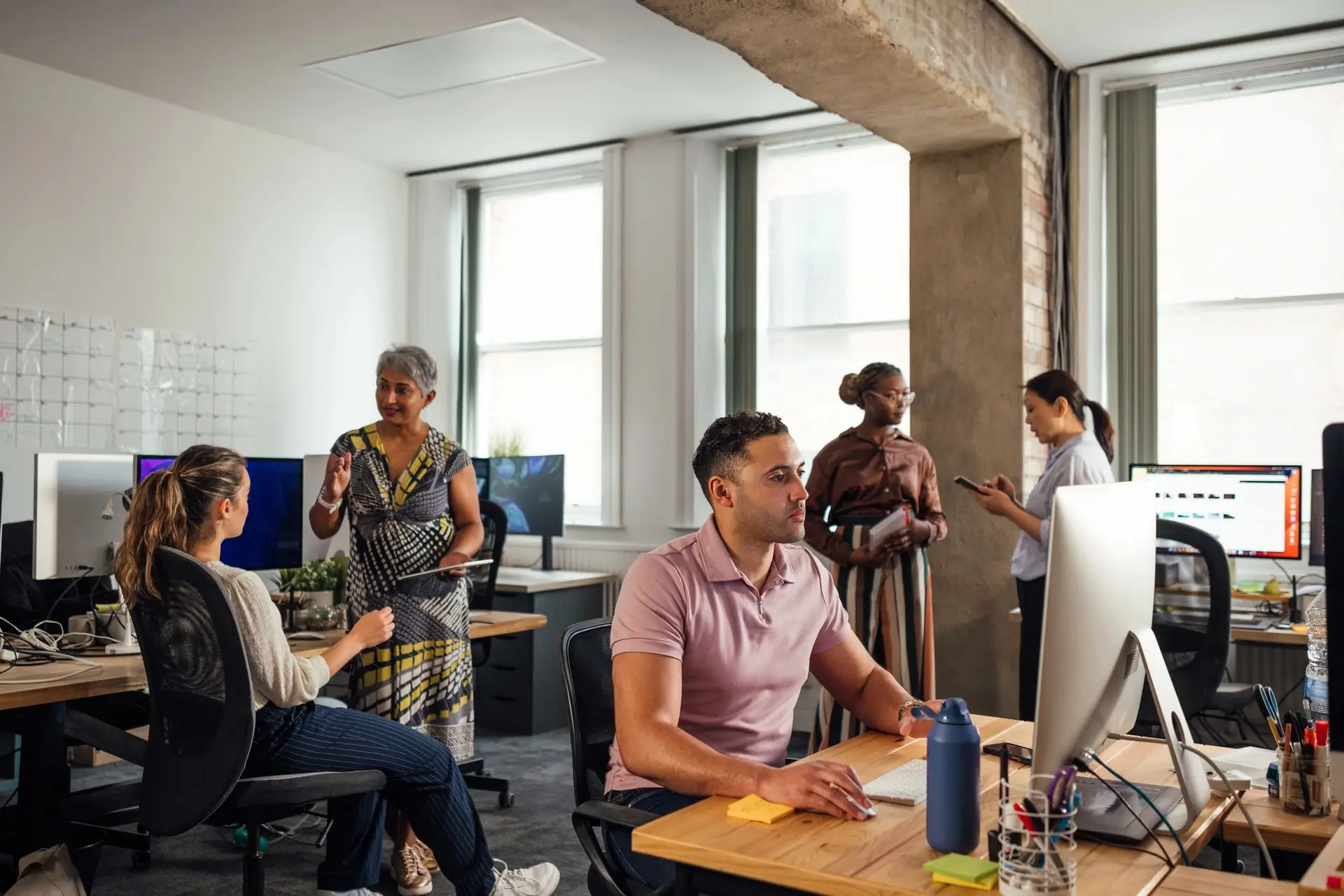 Office team working across connected systems