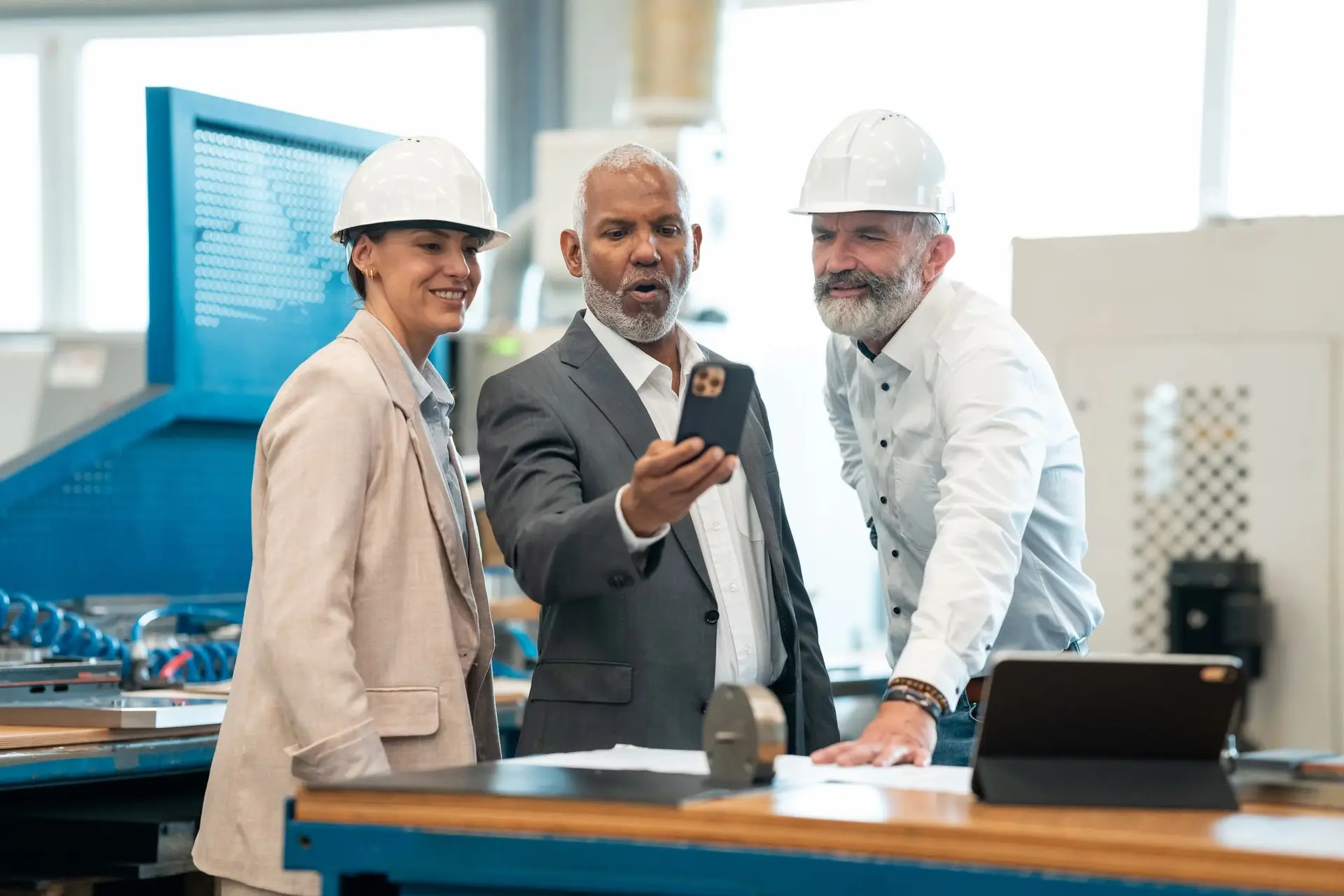 Engineers and business stakeholders reviewing automation plans