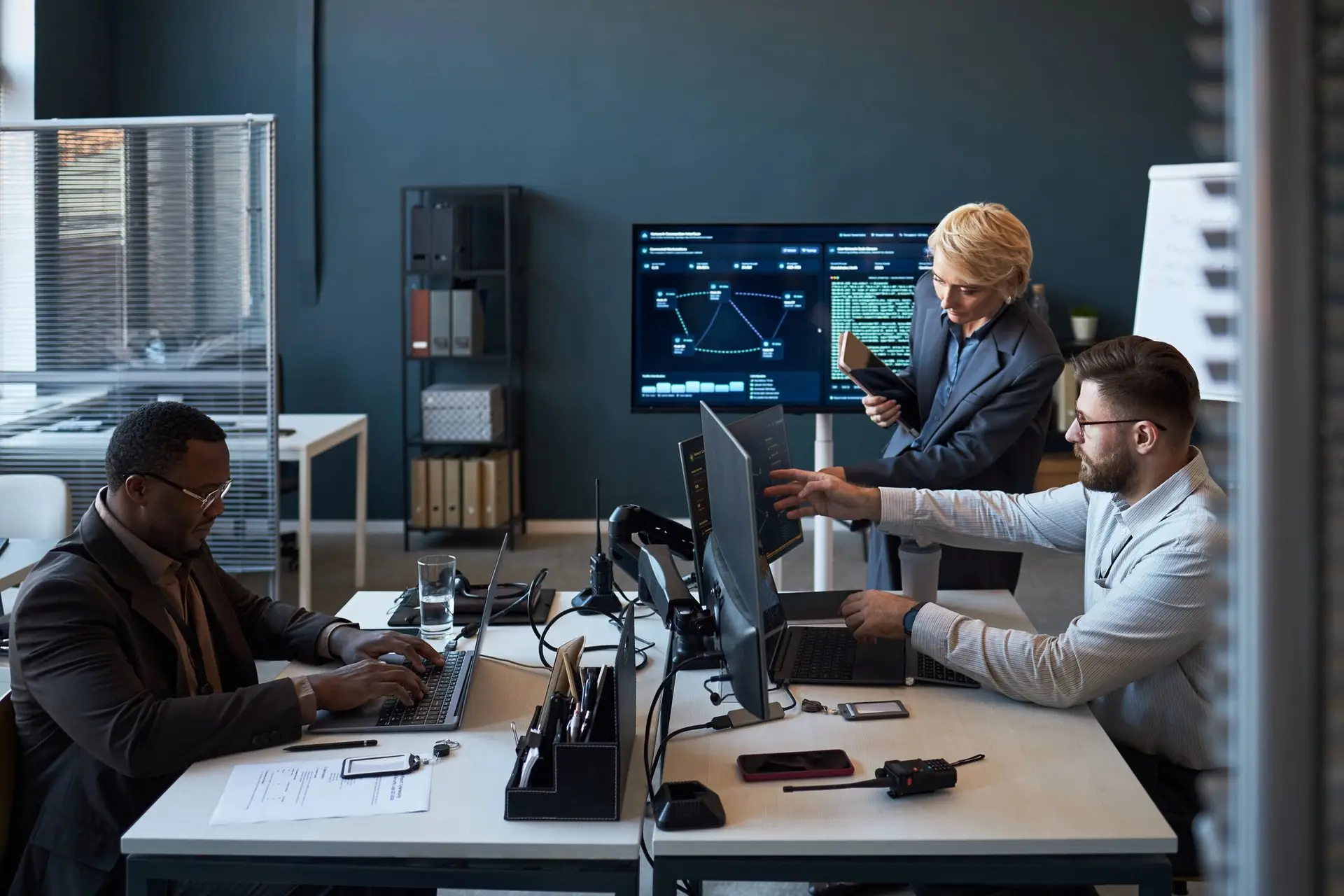 Business team reviewing analytics dashboards in an office