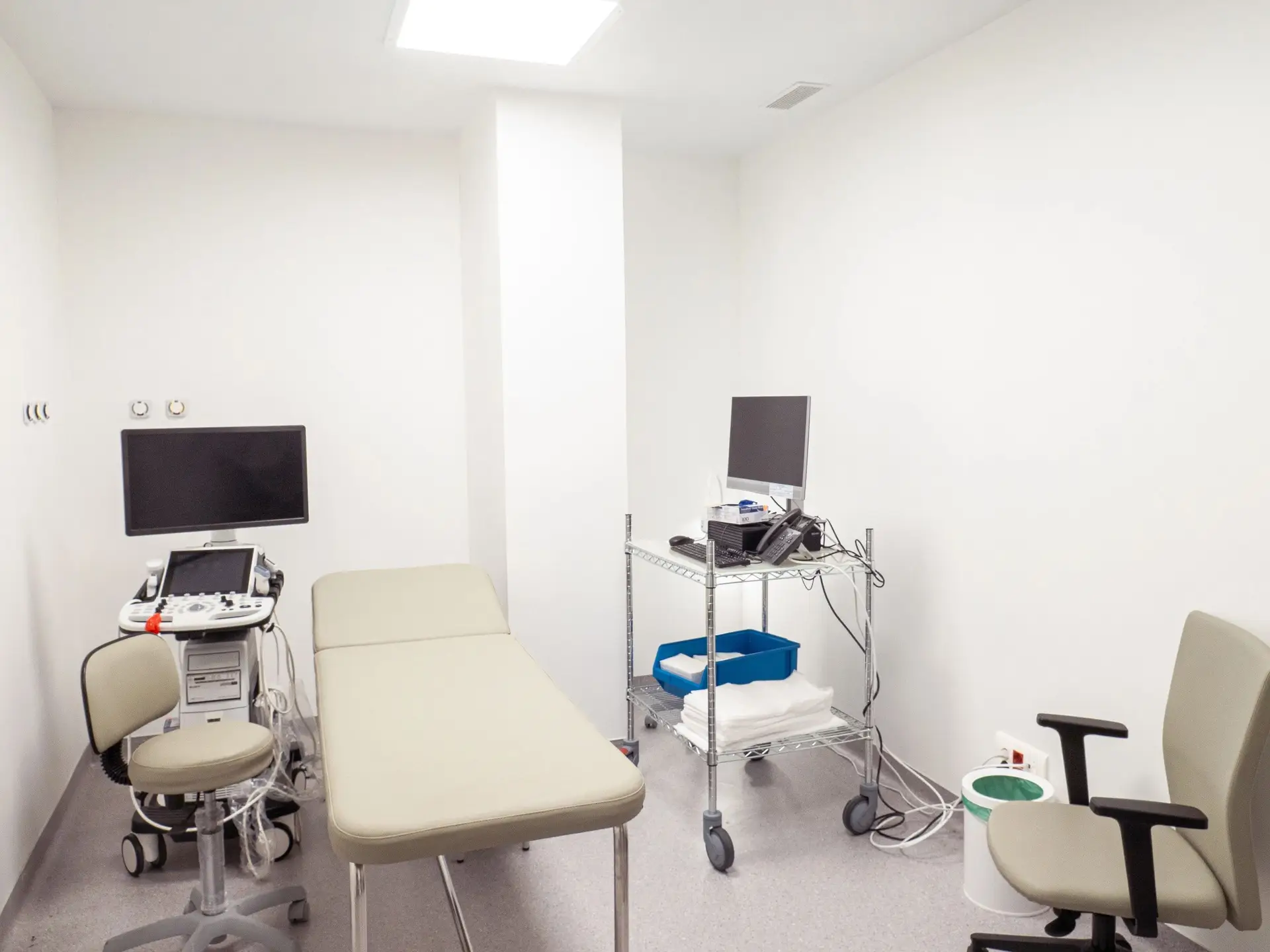 Modern medical examination room with diagnostic equipment