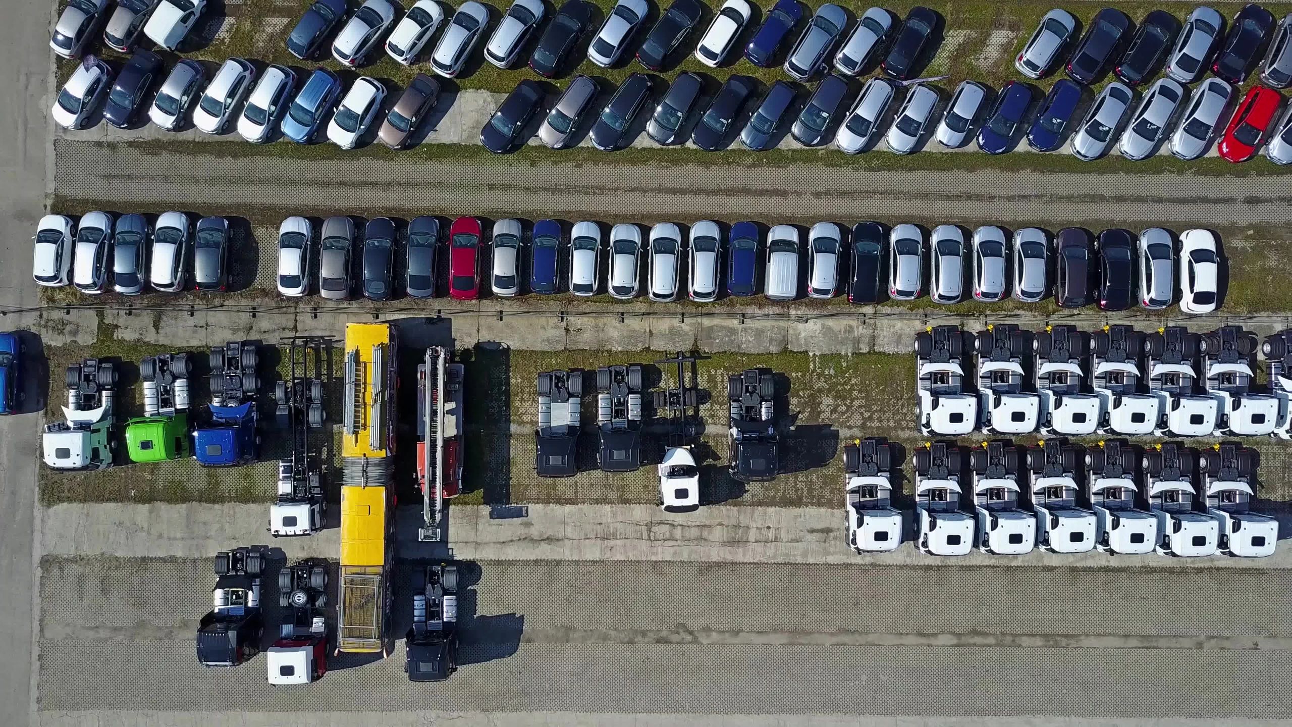 Aerial view of cars and trucks storage yard